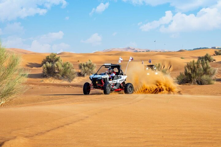 Experience the thrill of driving a Polaris 1000cc dune buggy across the stunning Arabian Desert. Feel the rush as you conquer the golden sands and create unforgettable memories.
